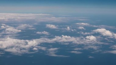 Clouds,view from airplane window, view of fields and meadows. view of the bay with turquoise water. mountain and quarry views