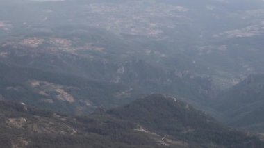 Clouds,view from airplane window, view of fields and meadows. view of the bay with turquoise water. mountain and quarry views