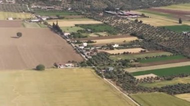 Clouds,view from airplane window, view of fields and meadows. view of the bay with turquoise water. mountain and quarry views