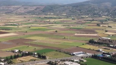 Clouds,view from airplane window, view of fields and meadows. view of the bay with turquoise water. mountain and quarry views