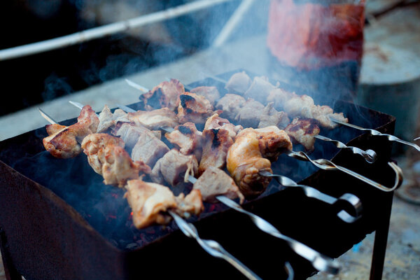 Background of crispy grilled meat and onion kebabs