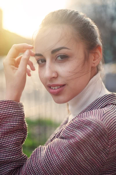 Young woman in jacket casual standing with city background at sunset .Sexy attractive fashion styling Image toned — Stock Photo, Image