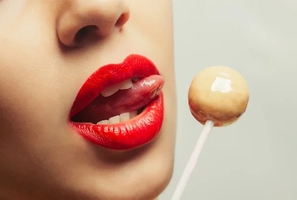 Young beautiful girl with lollipop in her mouth — Stock Photo, Image