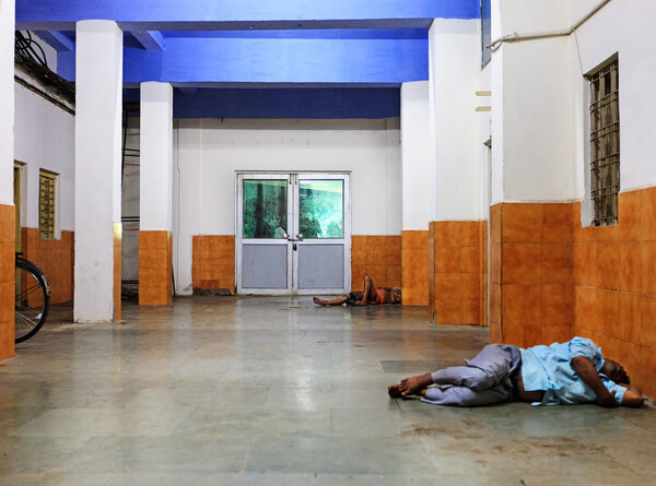 India, poor people sleeping on the floor