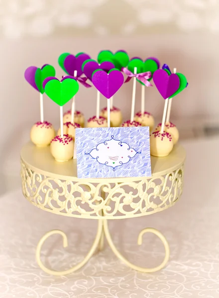 Cake-pops on carved roundel — Stock Photo, Image