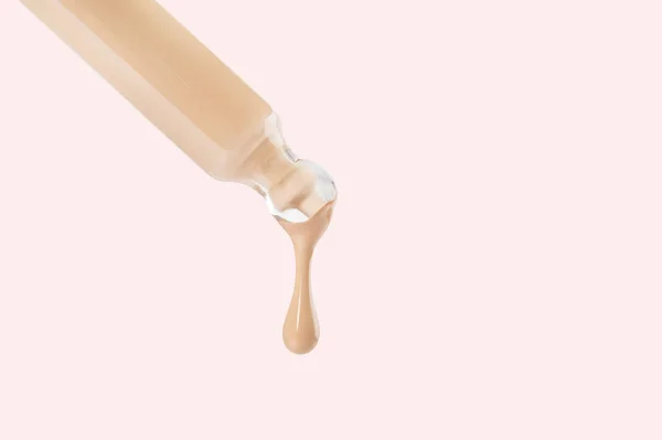 Glass Pipette Flowing Matte Nude Foundation Drop White Background Sample 图库照片