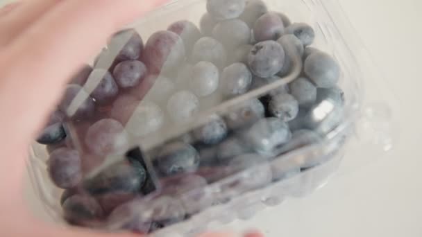 Woman Hands Long Nails Open Blueberries Plastic Container Standing White — Stock Video