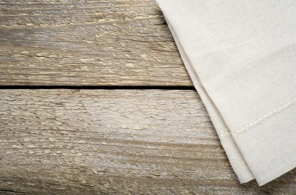 Paño de algodón beige natural sobre mesa de madera — Foto de Stock
