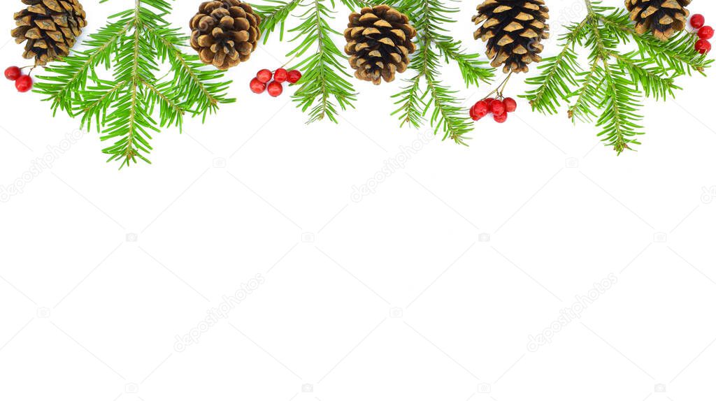 Christmas Border. Pine cones, fir branches, red berries on white background. New Year concept. Copy space.