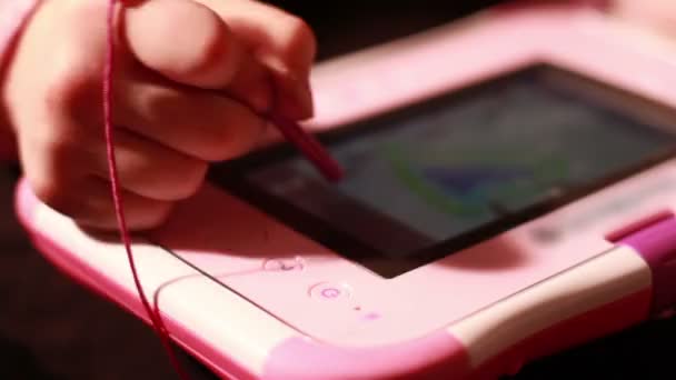 Girl draws on developmental  children's tablet — Stock Video