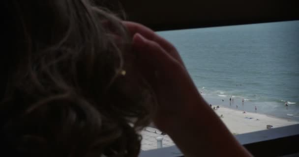 Child Looking At People Enjoying The Beach — Stock Video