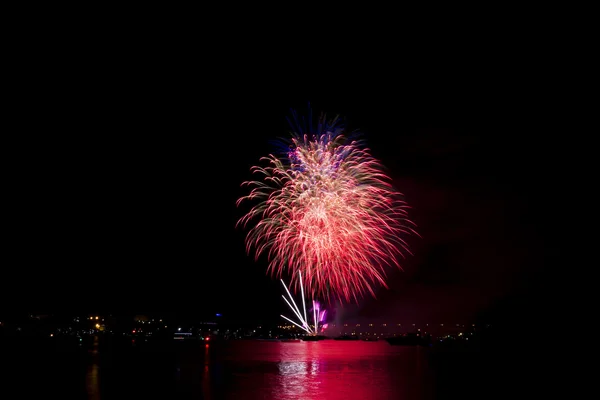 Fireworks summer night over the water of the river — Stock Photo, Image