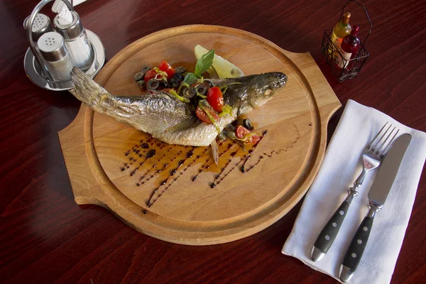 Fish plate on the board — Stock Photo, Image