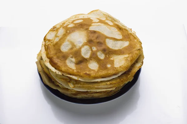 Pancakes on a plate on a white background — Stock Photo, Image