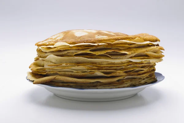 Pancakes on a plate on a white background — Stock Photo, Image