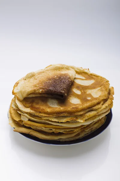 Pancakes on a plate on a white background — Stock Photo, Image