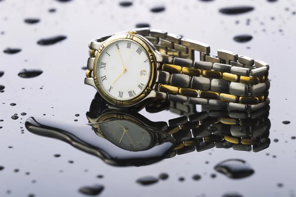 Wristwatches on a light background acrylic — Stock Photo, Image