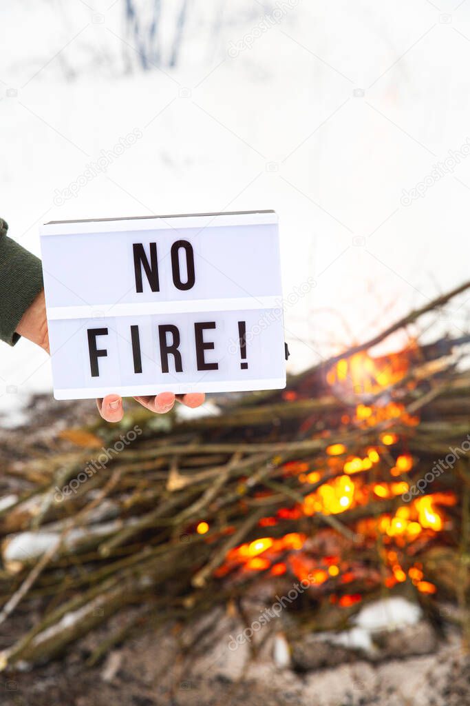 The concept of nature protection, protection from forest fires, ecology. Open fire warning.