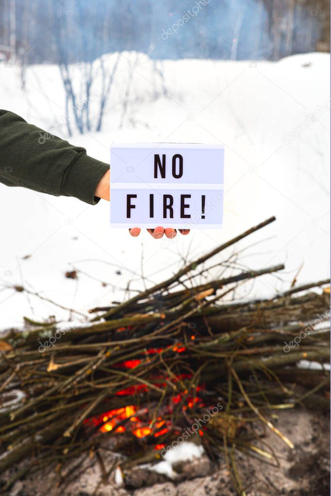 The concept of nature protection, protection from forest fires, ecology. Open fire warning.