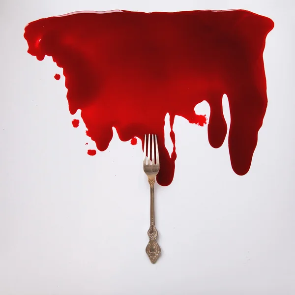 Fork in a blood pool — Stock Photo, Image