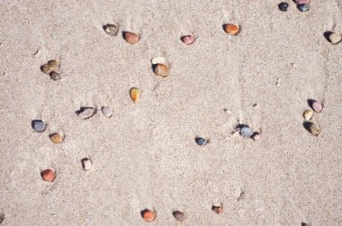 küçük çakıl kum arka planda