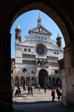 Ancient Cathedral of Cremona with famous Torrazzo bell tower at the beautiful market square Piazza Duomo in Cremona, Lombardy, Italy