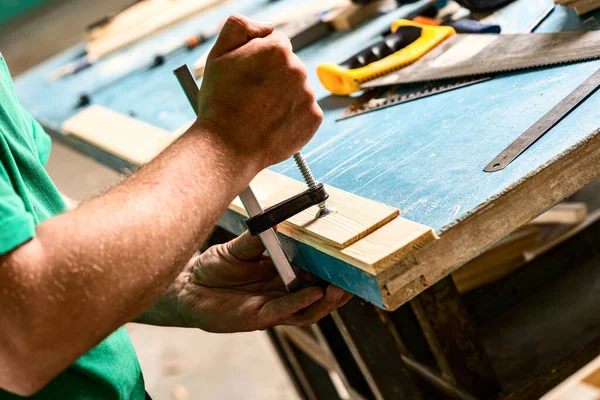 Man Green Shirt Tightens Clamp Table Clamps Wood Products Royalty Free Stock Images