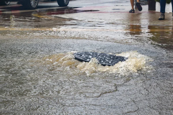 Open sewer overflowing by water after torrential rains and floods in the municipality of Benicssim - Benicsim, in Castelln, Autonomous Community of Valencia, in Spain. Horizontal photography.