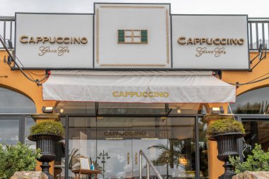 Puerto Portals, Spain; march 21 2021: Main facade of the cafeteria establishment called Cappuccino, located in the touristic area of Puerto Portals on the island of Mallorca, Spain