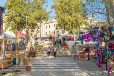 Sineu, Spain; april 14 2021: Weekly street market in the Majorcan town of Sineu in times of the de-escalation of the Coronavirus pandemic.