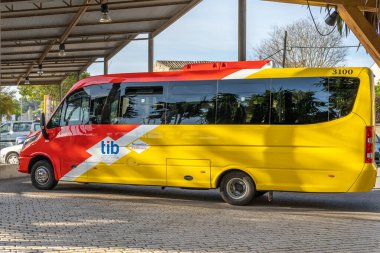 Sineu, Spain; april 14 2021: bus of line of the island of Majorca that unites the towns with the capital. Bus driver in the town of Sineu
