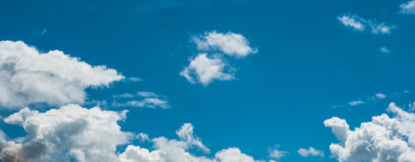 Bright blue sky with clouds indicate freshness.