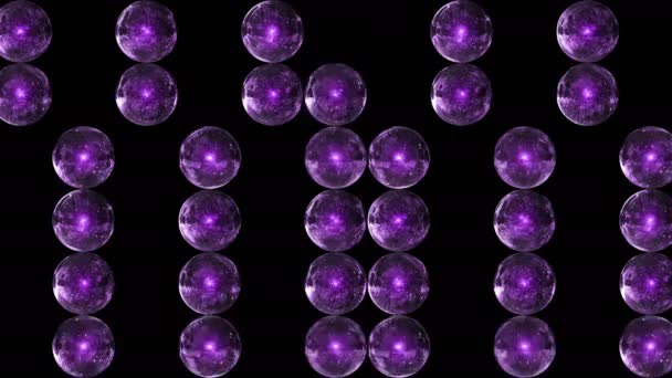 Purple glass marbles appear and disappear dynamically. Background from spheres. — Stockvideo