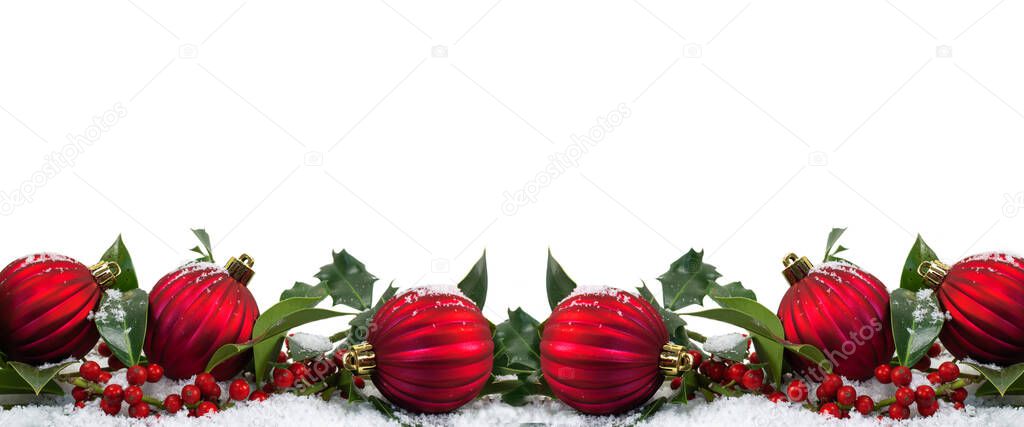 Wide Christmas border with red baubles and berries isolated on white background.