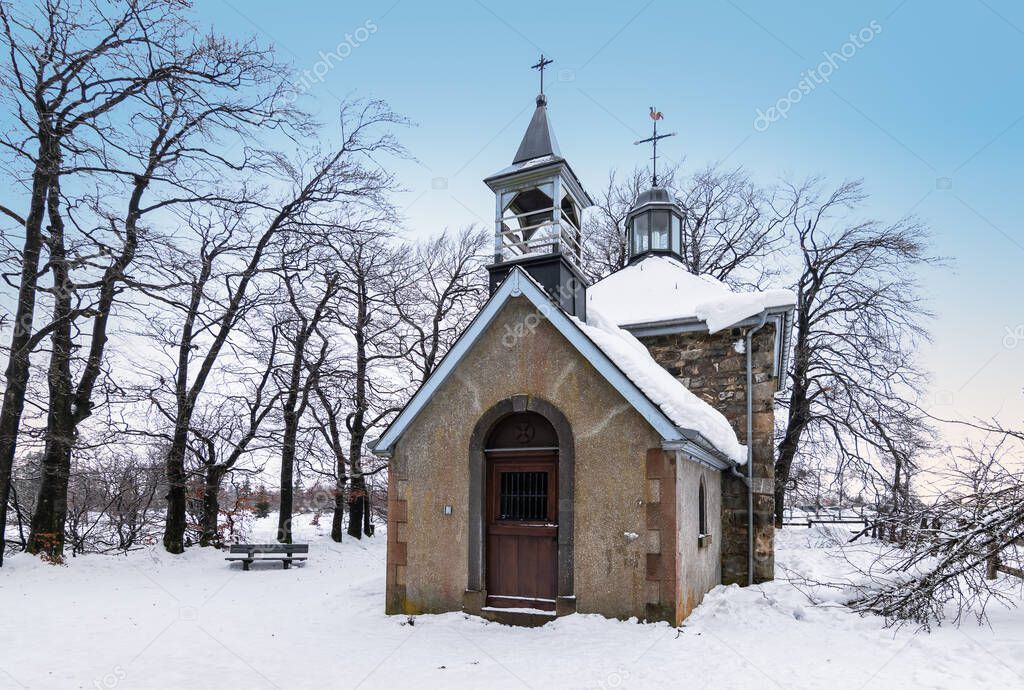 Fischbach Chapel on top of the Baraque Michel in winter. High Fens, Belgian Ardennes.