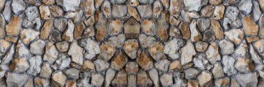 Farklı dokulara sahip taş duvarın arka planı. Geniş resim.