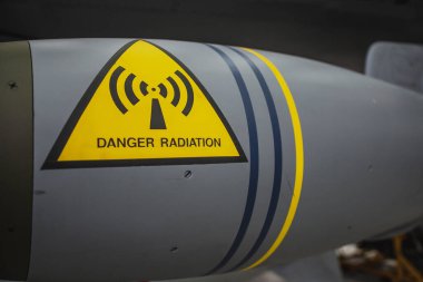Duxford England May 2021 Danger Radiation sign on a bomb of a fighter jet airplane, most likely containing depleted uranium
