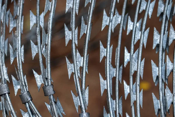 form of sharp barbed wire which is usually used for building safety