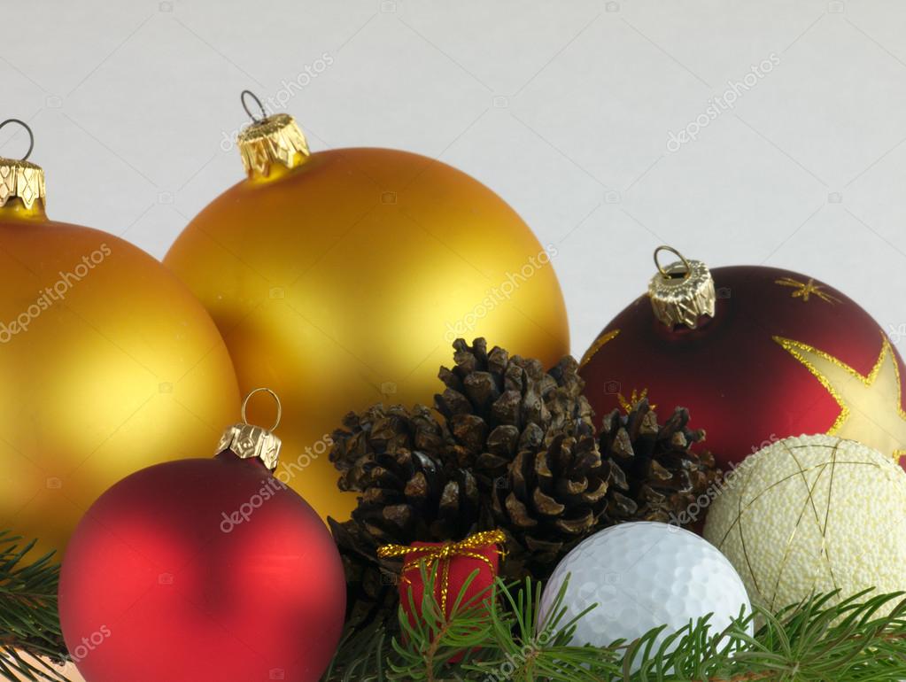 Red and gold Christmas balls on pine twig with a pine cones a white background Golf ball hidden in Christmas balls — ZdjÄ™cie od Kamiwro1