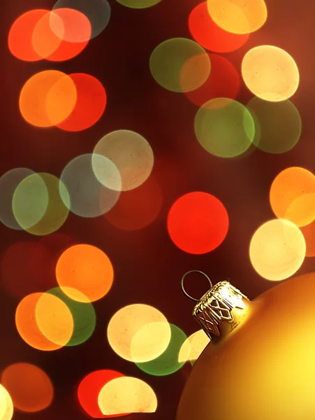 Golden Christmas Tree bauble and magic bokeh. — Stock Photo, Image