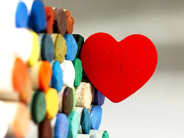 Heart and colored dry pastels closely. — Stock Photo, Image