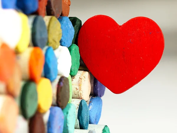 Heart and colored dry pastels closely. — Stock Photo, Image