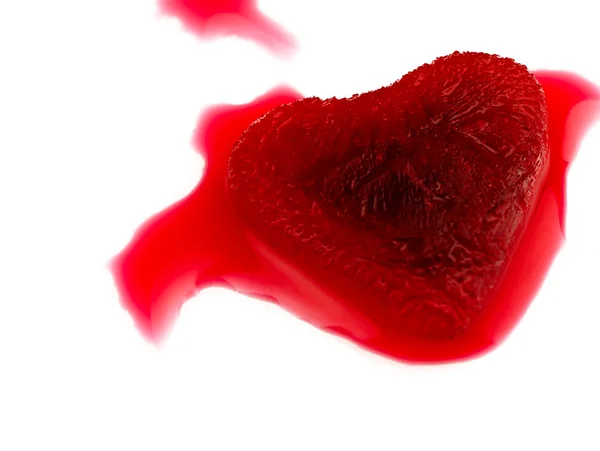 Red heart-shaped ice in the blood. Stock Image