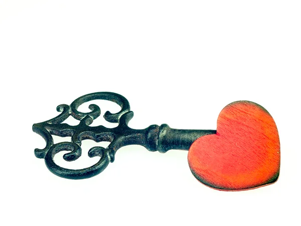 Old metal key and red heart. — Stock Photo, Image