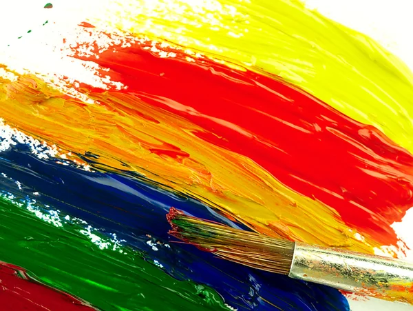 Color traces and brush on a white sheet of paper. — Stock Photo, Image