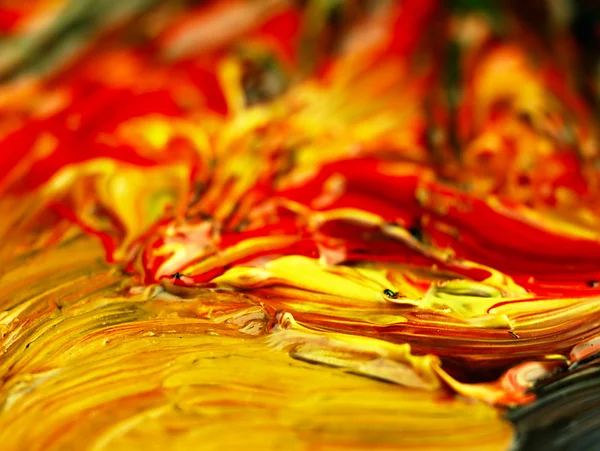 Gekleurde verf gemixt op palet. — Stockfoto