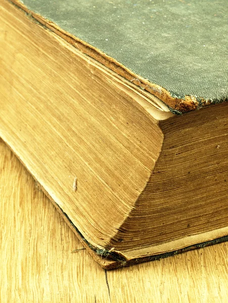 Old closed the book with a damaged cover. — Stock Photo, Image