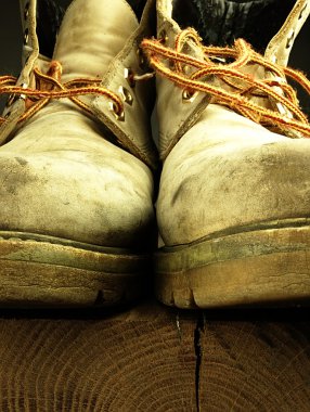 Pair of old, worn heavy boots. clipart