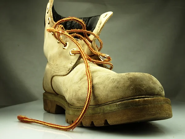 Military boot. Old heavy and destroyed. — Stock Photo, Image