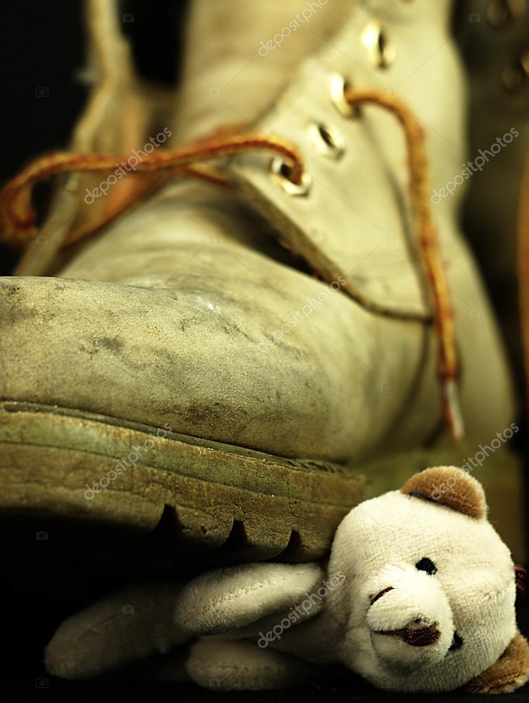 Teddy bear crushed by a heavy, old military boot. Stock Photo by ...